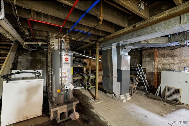 2511 Pine Ave, Niagara Falls, NY 14301 - unfinished basement featuring water heater, heating unit, and washer / dryer