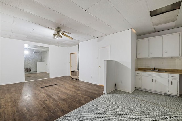 2511 Pine Ave, Niagara Falls, NY 14301 - unfurnished living room with a ceiling fan, light wood finished floors, and heating unit