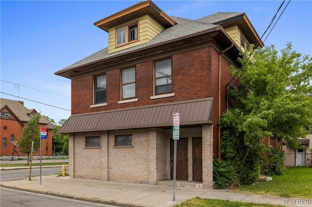 700 Pine Ave, Niagara Falls, NY 14301 - view of front of house featuring brick siding and a shingled roof