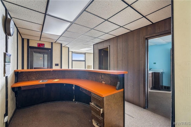 700 Pine Ave, Niagara Falls, NY 14301 - unfurnished office with carpet flooring, wood walls, and a paneled ceiling