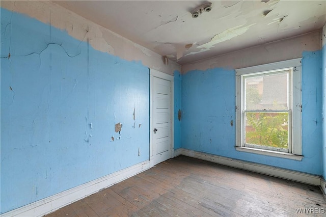 700 Pine Ave, Niagara Falls, NY 14301 - unfurnished room featuring wood-type flooring and a baseboard heating unit