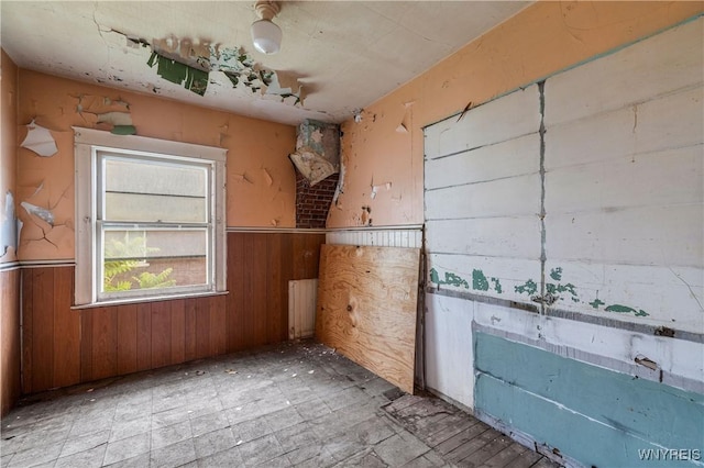 700 Pine Ave, Niagara Falls, NY 14301 - unfurnished room with wainscoting and wooden walls