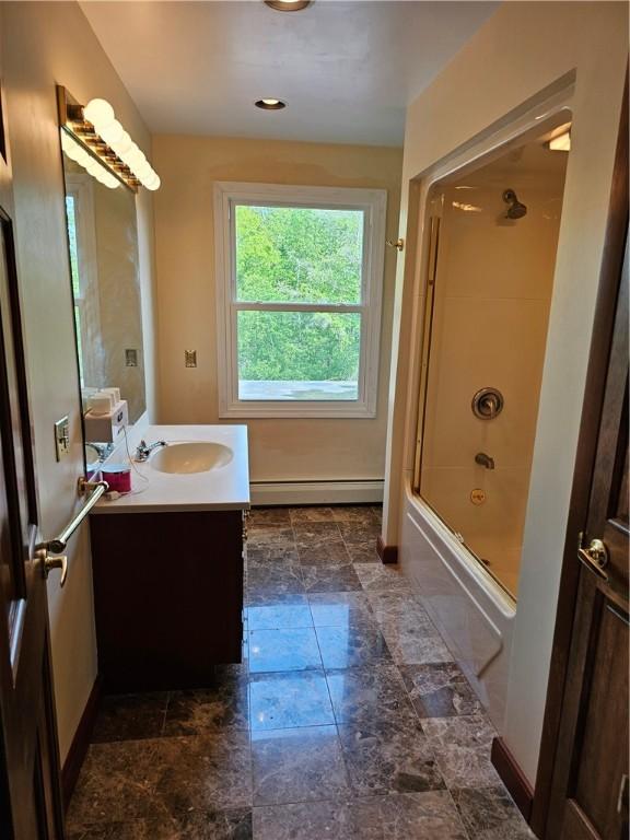 818 Larchmont Cir, Elmira, NY 14905 - full bathroom featuring vanity, baseboard heating, shower / washtub combination, and marble look tile flooring