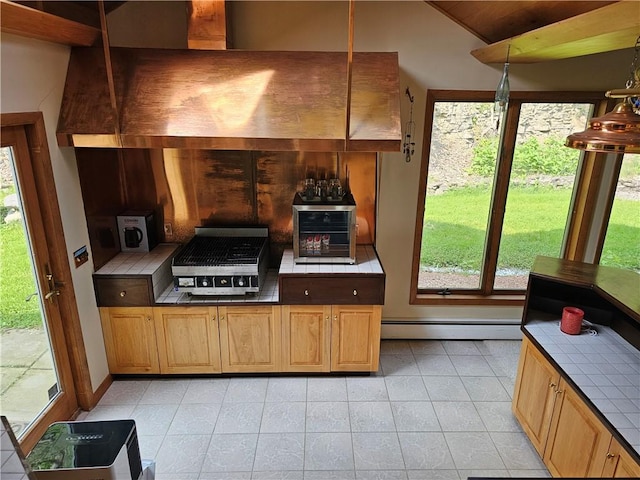 818 Larchmont Cir, Elmira, NY 14905 - kitchen with tile countertops, baseboard heating, vaulted ceiling, and light tile patterned flooring