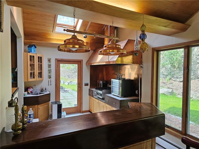 818 Larchmont Cir, Elmira, NY 14905 - kitchen with a skylight, wood ceiling, stainless steel gas cooktop, glass insert cabinets, and a baseboard radiator