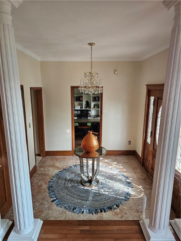 818 Larchmont Cir, Elmira, NY 14905 - dining space featuring decorative columns, a chandelier, and crown molding