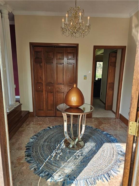818 Larchmont Cir, Elmira, NY 14905 - entrance foyer featuring crown molding, a chandelier, and decorative columns