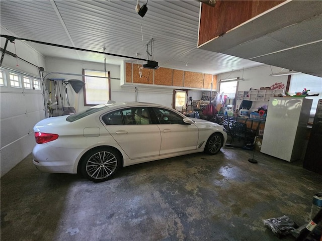 818 Larchmont Cir, Elmira, NY 14905 - garage featuring a garage door opener
