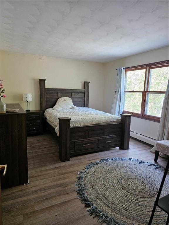 818 Larchmont Cir, Elmira, NY 14905 - bedroom with dark wood finished floors and baseboard heating