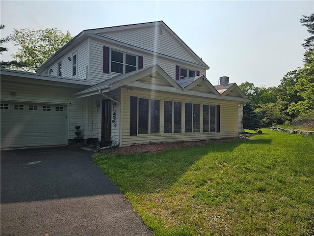 818 Larchmont Cir, Elmira, NY 14905 - traditional home featuring a garage, a front yard, and asphalt driveway