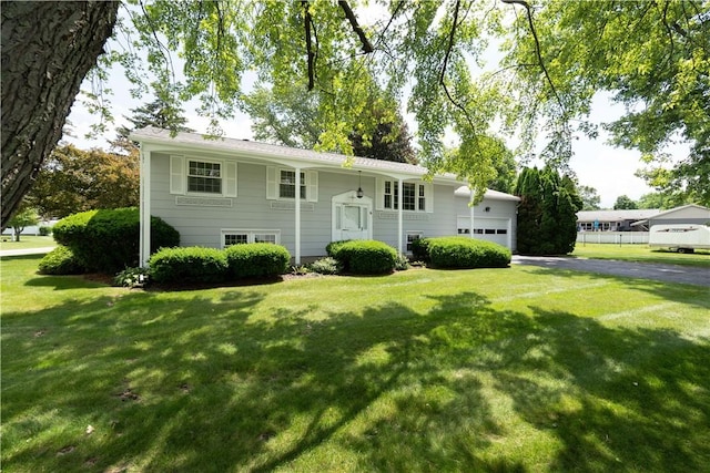 6 Meadowbrook Ter, North Dansville, NY 14437 - raised ranch with driveway, a front lawn, and a garage