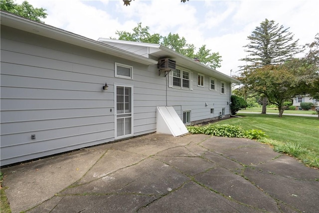 6 Meadowbrook Ter, North Dansville, NY 14437 - rear view of house featuring a patio, a lawn, and a wall mounted air conditioner