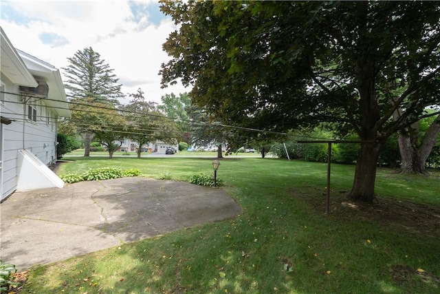 6 Meadowbrook Ter, North Dansville, NY 14437 - view of green lawn featuring a patio area