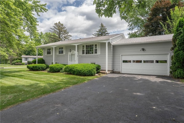 6 Meadowbrook Ter, North Dansville, NY 14437 - bi-level home featuring asphalt driveway, an attached garage, and a front lawn