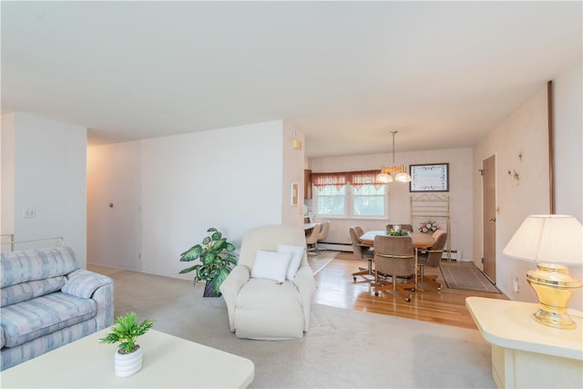 6 Meadowbrook Ter, North Dansville, NY 14437 - living area with a chandelier, baseboard heating, and light colored carpet