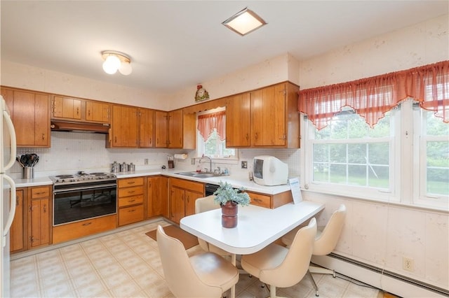 6 Meadowbrook Ter, North Dansville, NY 14437 - kitchen featuring baseboard heating, stainless steel range oven, brown cabinets, and light countertops