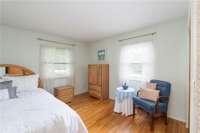 6 Meadowbrook Ter, North Dansville, NY 14437 - bedroom with wallpapered walls and light wood-style floors