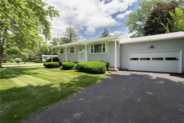 6 Meadowbrook Ter, North Dansville, NY 14437 - view of front of home featuring asphalt driveway, an attached garage, and a front lawn