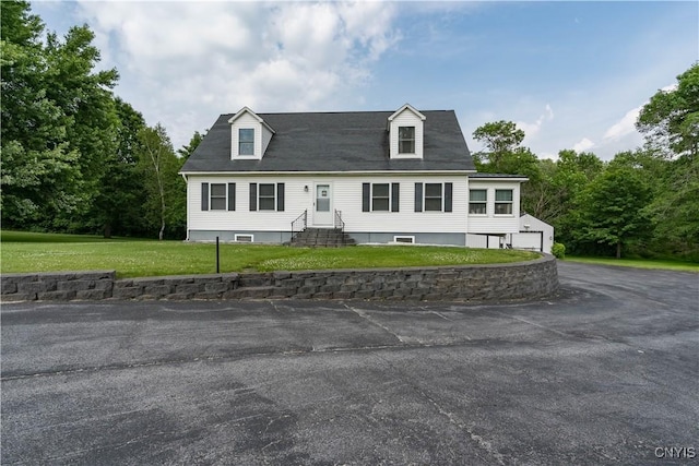 60 Van Buren St, Antwerp, NY 13608 - cape cod home with entry steps, a front yard, and a garage