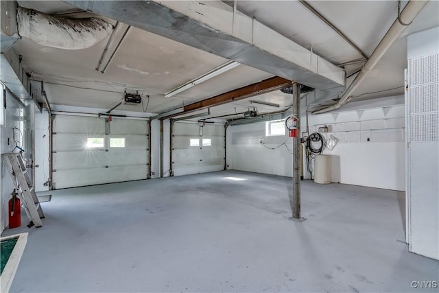 60 Van Buren St, Antwerp, NY 13608 - garage featuring a garage door opener and a heating unit