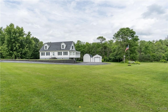 60 Van Buren St, Antwerp, NY 13608 - view of grassy yard with an outdoor structure and a detached garage