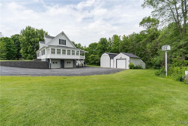 60 Van Buren St, Antwerp, NY 13608 - view of front facade featuring a front lawn, an outdoor structure, and stairs