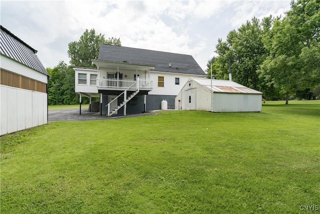60 Van Buren St, Antwerp, NY 13608 - back of house featuring stairs, a yard, an outbuilding, and a deck