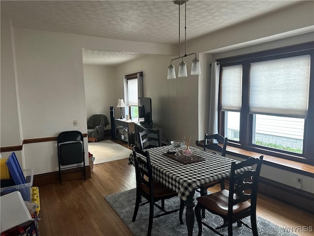 115 N 17th St, Olean-City, NY 14760 - dining area with a textured ceiling and dark wood-style flooring