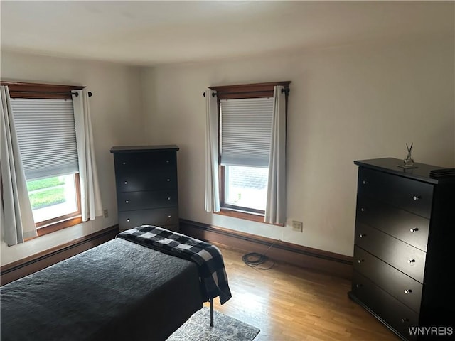 115 N 17th St, Olean-City, NY 14760 - bedroom featuring wood finished floors and baseboards