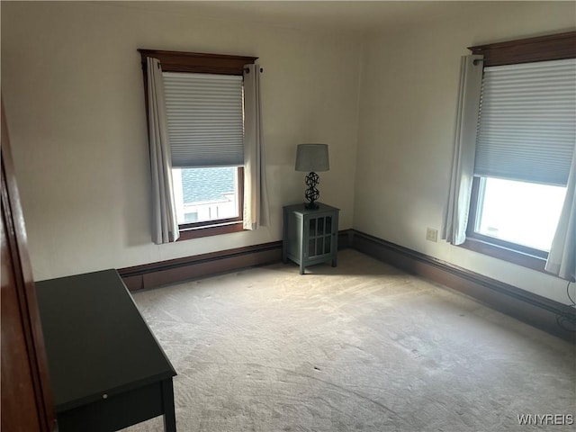 115 N 17th St, Olean-City, NY 14760 - empty room featuring a baseboard radiator and carpet flooring