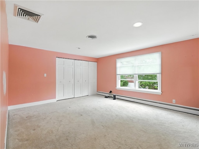 71 Saratoga Rd, Amherst, NY 14226 - unfurnished bedroom with a baseboard radiator, carpet, a closet, and recessed lighting