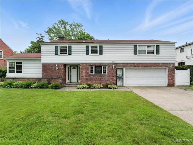 71 Saratoga Rd, Amherst, NY 14226 - view of front of house featuring brick siding, an attached garage, and driveway