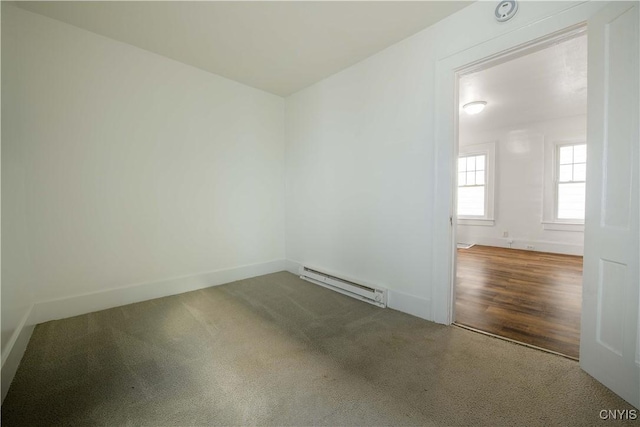 209 Lakeview Ave, Syracuse, NY 13204 - carpeted empty room with a baseboard heating unit and baseboards