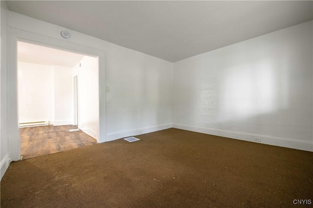209 Lakeview Ave, Syracuse, NY 13204 - carpeted empty room featuring a baseboard heating unit and a smoke detector