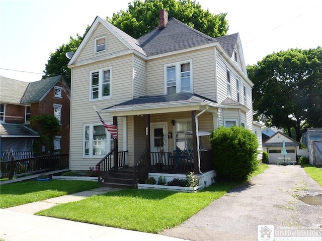 174 Bowen St, Jamestown, NY 14701 - view of front of property featuring covered porch, a shingled roof, a front yard, a chimney, and an outbuilding