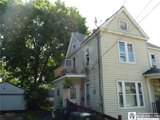 174 Bowen St, Jamestown, NY 14701 - view of property exterior with a balcony, an outbuilding, and a garage