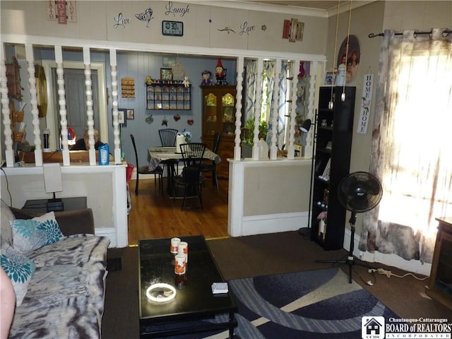 174 Bowen St, Jamestown, NY 14701 - living room with plenty of natural light, wood finished floors, and crown molding
