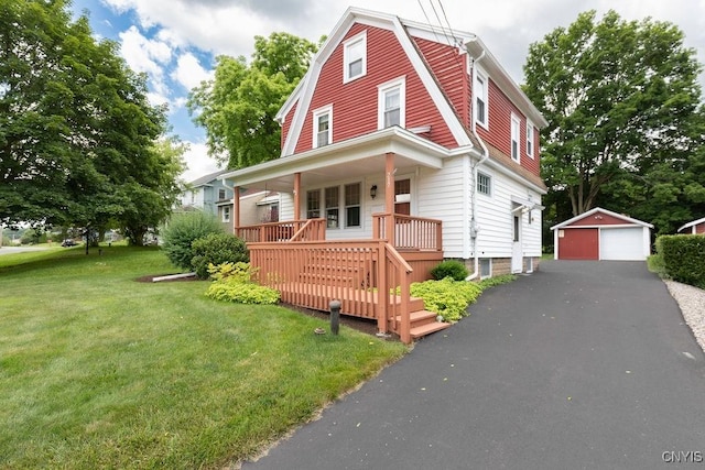 217 Mackay Ave, Camillus, NY 13219 - dutch colonial featuring a porch, a garage, an outdoor structure, a front lawn, and a gambrel roof