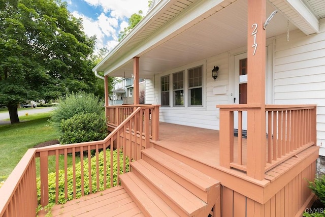 217 Mackay Ave, Camillus, NY 13219 - wooden porch featuring a yard
