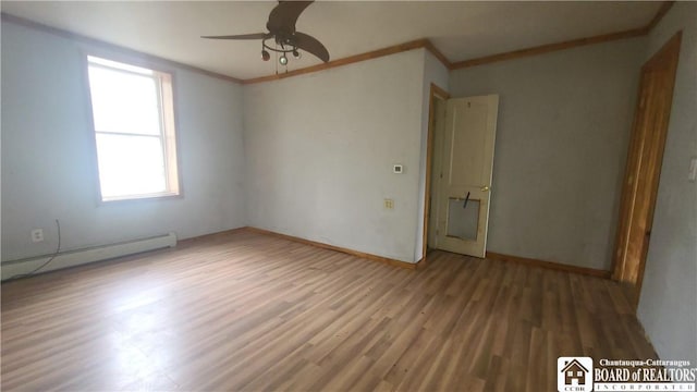 4010 Main St, Scio, NY 14880 - unfurnished room featuring a baseboard heating unit, wood finished floors, ceiling fan, and crown molding