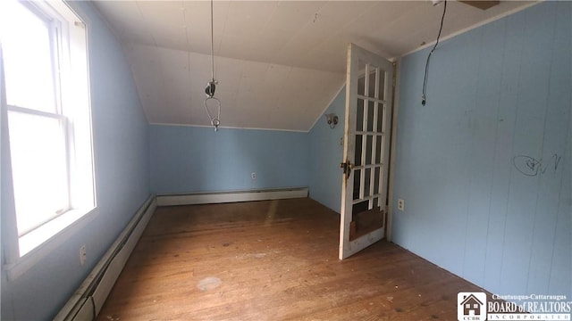 4010 Main St, Scio, NY 14880 - bonus room featuring baseboard heating, hardwood / wood-style flooring, and vaulted ceiling