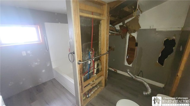 4010 Main St, Scio, NY 14880 - full bath featuring wood finished floors and tub / shower combination