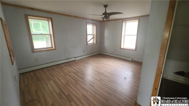 4010 Main St, Scio, NY 14880 - spare room featuring plenty of natural light, wood finished floors, and ceiling fan
