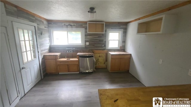 4010 Main St, Scio, NY 14880 - kitchen with light wood finished floors, a textured ceiling, and brown cabinets