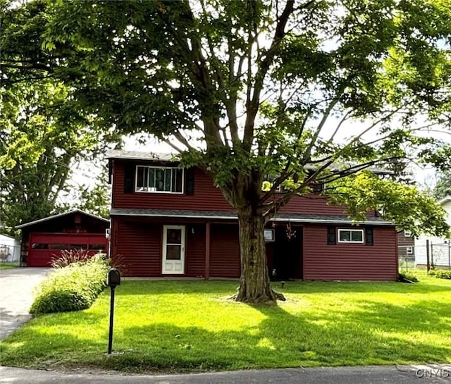 6473 Wembridge Dr, Dewitt, NY 13057 - view of front of house featuring a front lawn, an outbuilding, and driveway