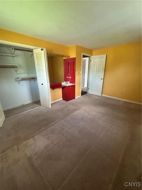 6473 Wembridge Dr, Dewitt, NY 13057 - unfurnished bedroom featuring baseboards and a closet