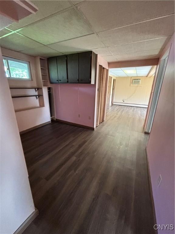 6473 Wembridge Dr, Dewitt, NY 13057 - hallway with a paneled ceiling and dark wood finished floors
