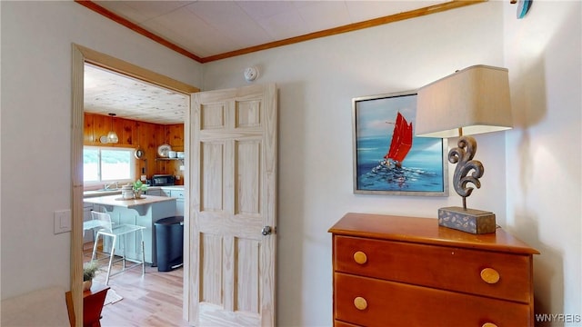 15794 W Lake Rd, Pulteney, NY 14874 - hallway featuring ornamental molding, light wood finished floors, and wooden walls