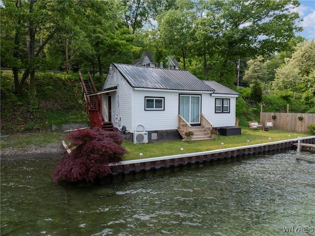 15794 W Lake Rd, Pulteney, NY 14874 - view of front of property with entry steps, a water view, stairway, a metal roof, and view of wooded area