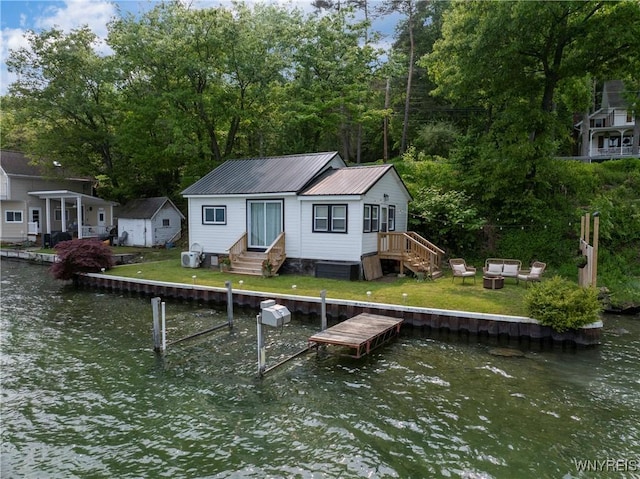 15794 W Lake Rd, Pulteney, NY 14874 - dock area with a water view, entry steps, and an outdoor fire pit